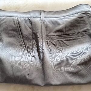 Man’s golf shorts by Adidas. Size 35 in light gray.